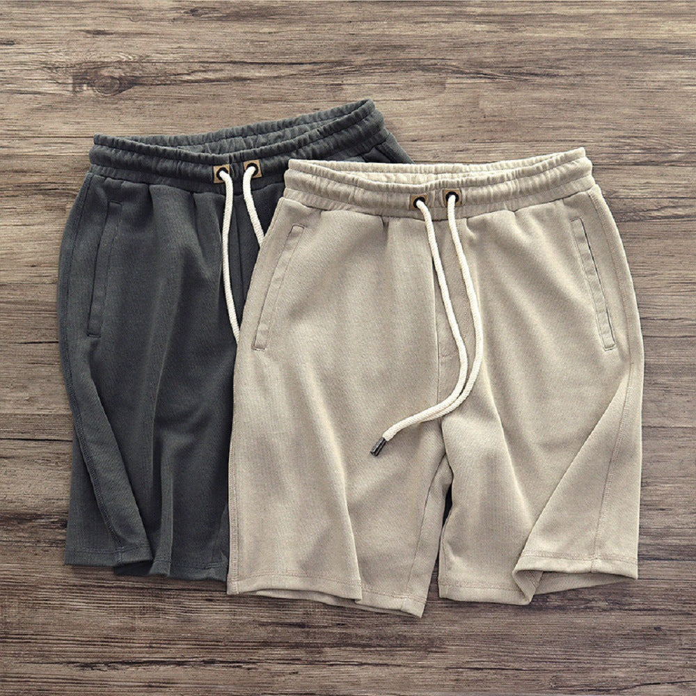 Pantaloncini uomo casual in tinta unita con coulisse, ideali per l'estate, relax e comfort. Stile sportivo.