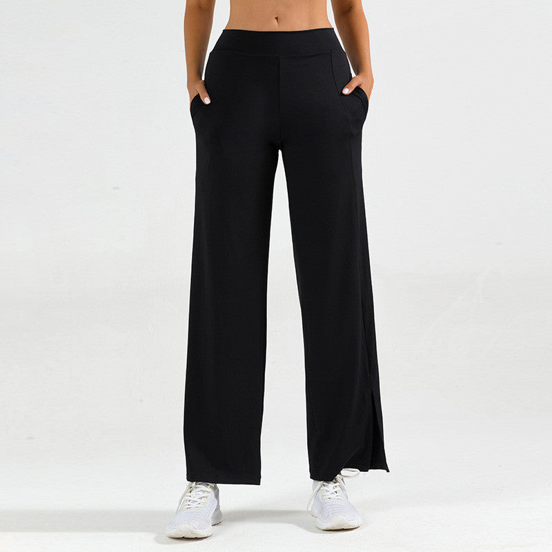 Pantaloni yoga donna a zampa d'elefante neri con spacco laterale per fitness e pilates.