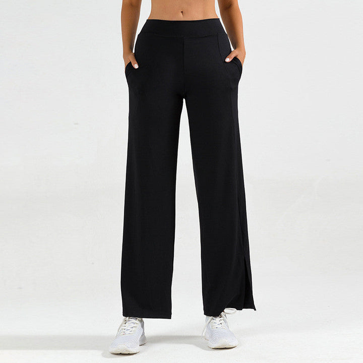 Pantaloni yoga donna a zampa d'elefante neri con spacco laterale per fitness e pilates.
