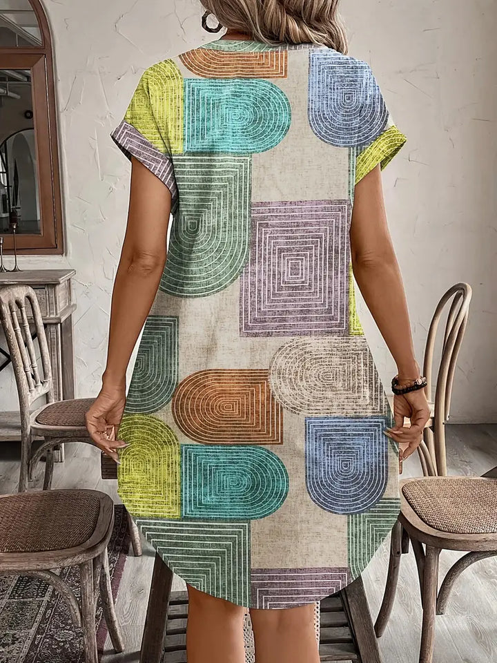 Vestito midi geometrico donna, stampa chic ed elegante. Ideale per moda femminile primaverile ed estiva.