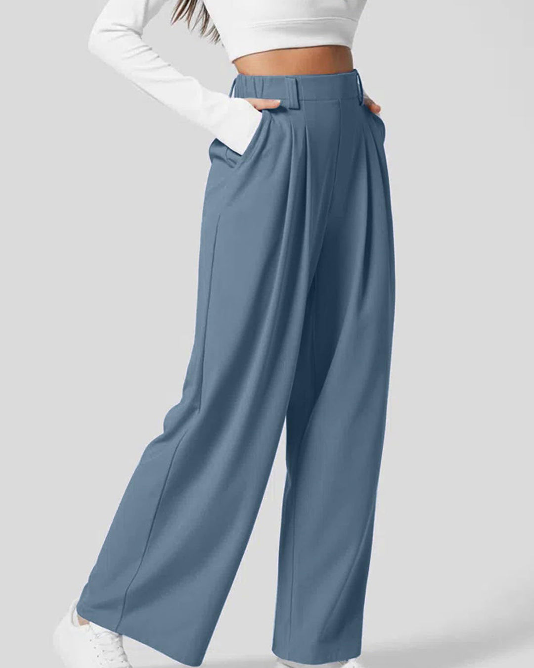 Pantaloni casual chic donna a vita alta, gamba ampia, con dettaglio waffle. Stile e comfort in un unico capo.