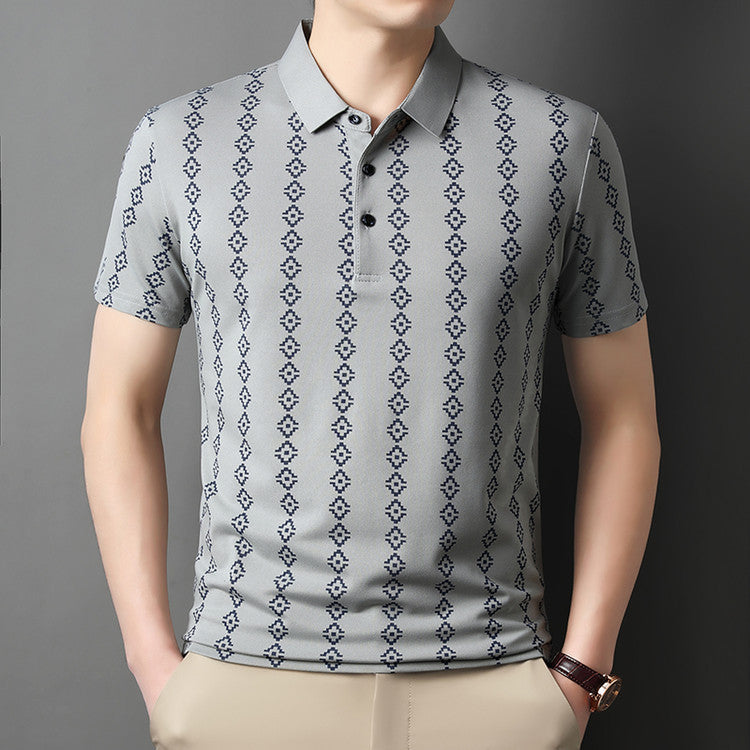 Polo uomo casual grigia con stampa floreale e design asimmetrico, per un'estate confortevole.
