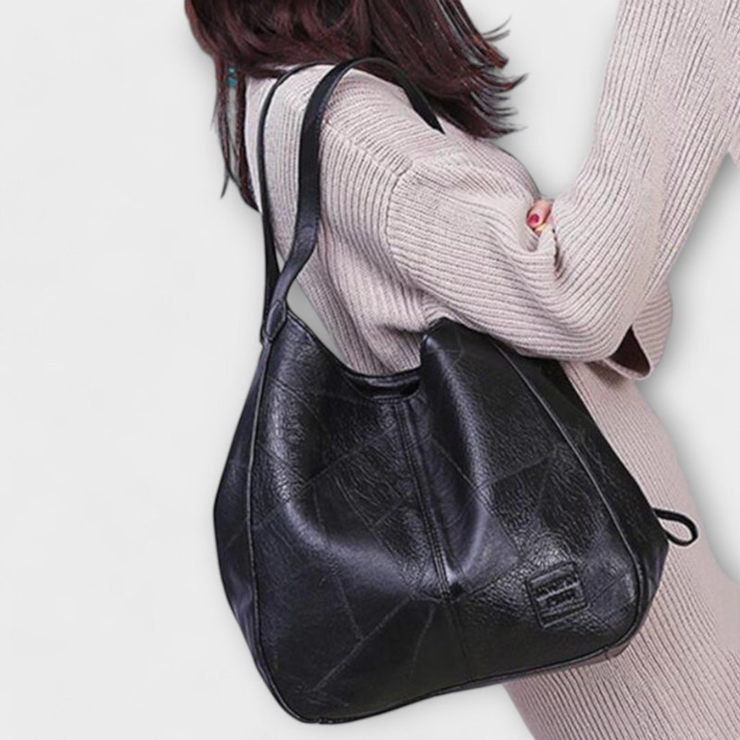 Borsa donna vintage, stile retrò effetto pelle, accessorio versatile per look quotidiani.