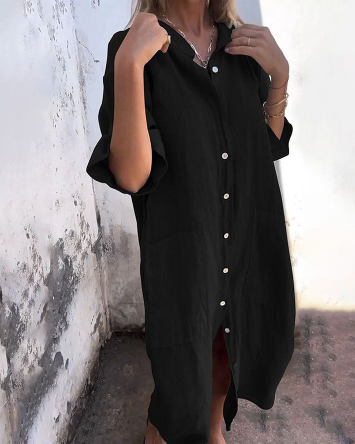 Moda donna: abito midi nero casual-elegante, vestibilità ampia e confortevole, perfetto per l'estate.