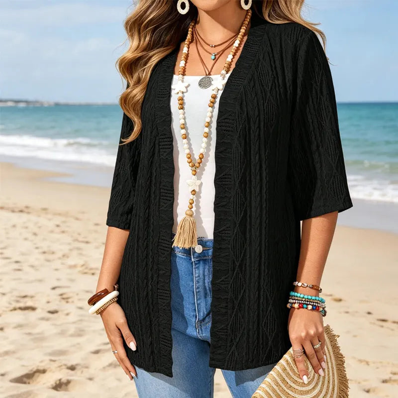 Cardigan donna leggero con maniche 3/4, design traforato elegante per look casual chic.