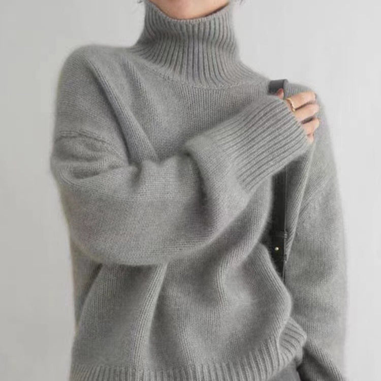 Maglione dolcevita spesso donna grigio, pullover caldo e comodo per l'inverno. Comfort per ogni giorno.