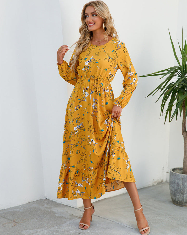 Abito lungo floreale da festa, elegante e moderno, con scollo rotondo per un outfit da donna.