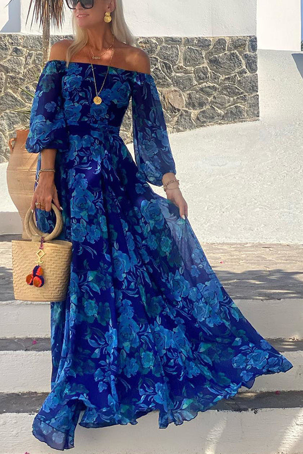 Maxi abito donna blu con stampa floreale e spalle scoperte, perfetto per moda estiva casual ed elegante.