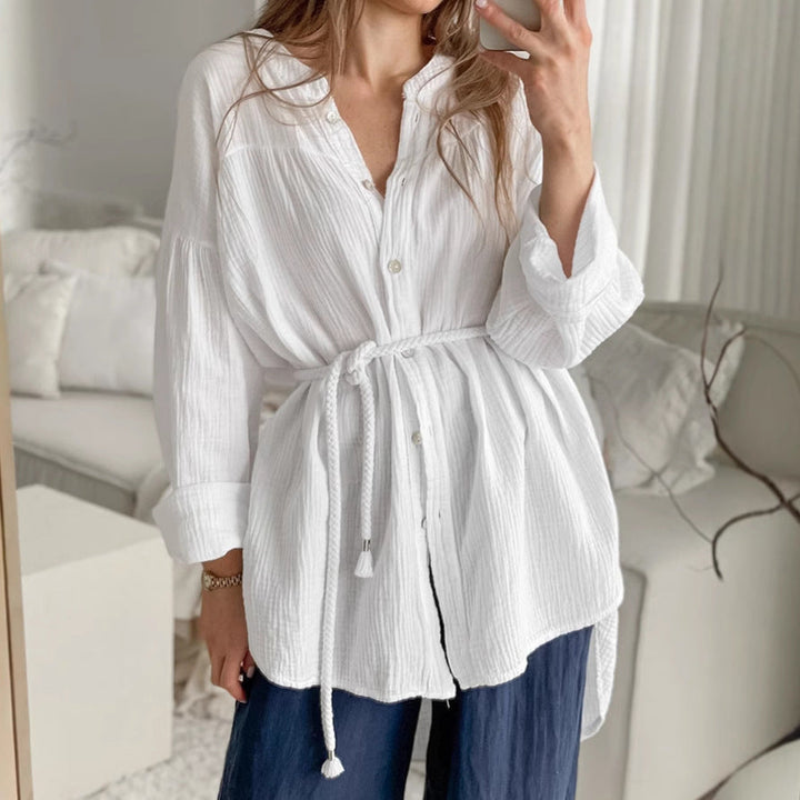 Elegante camicia donna bianca manica lunga con colletto coreana e cintura, must-have per la moda femminile.