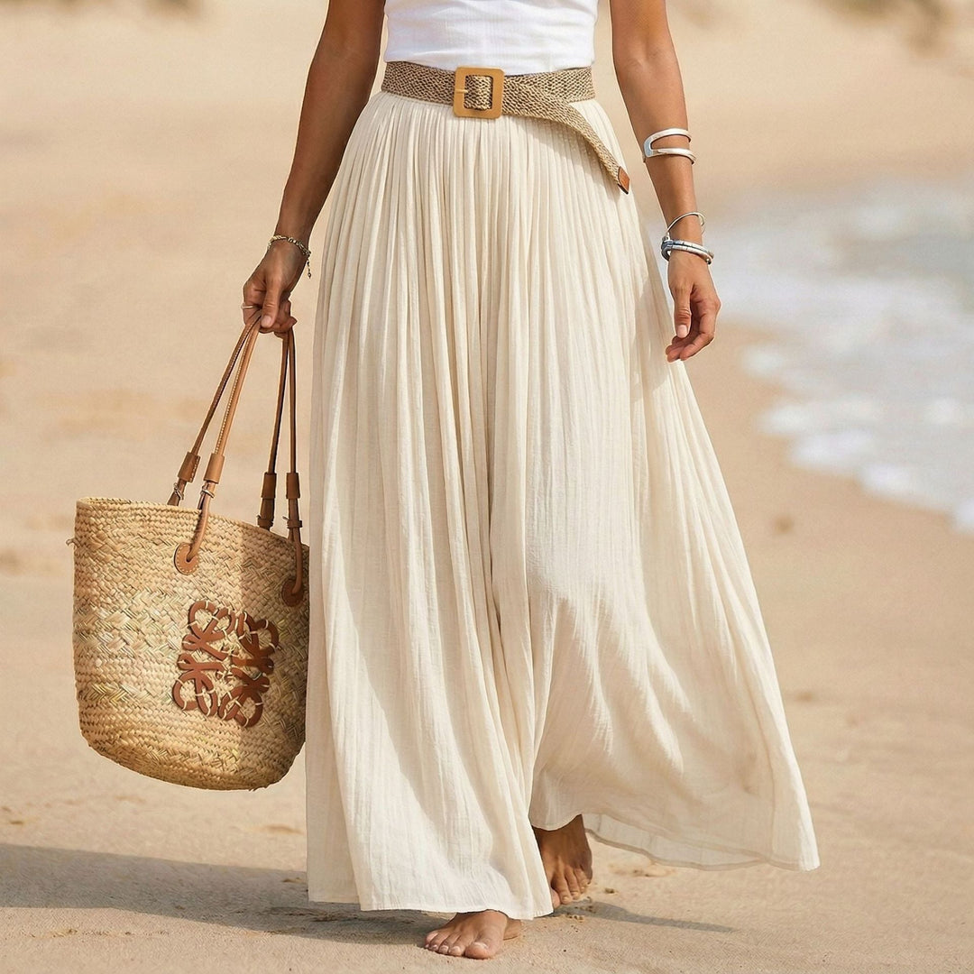 Abito estivo elegante, donna, taglio svasato e vita morbida. Perfetto per il mare e relax.