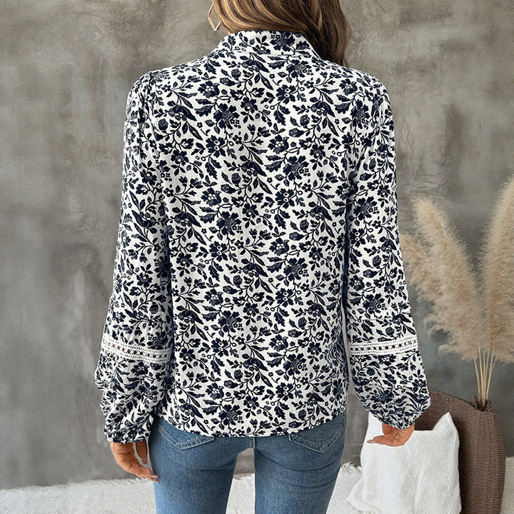 Camicia donna a V, pullover con stampa floreale, maniche a lanterna. Un must-have della moda femminile.