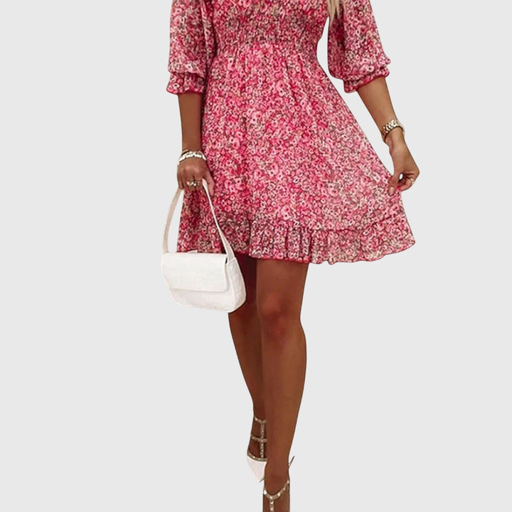Fresco abito estivo donna floreale, maniche a sbuffo, scollo a V, perfetto per un look vacanza.