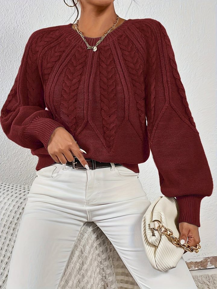 Maglia donna con maniche a palloncino, motivo a trecce. Comodità e stile per la stagione fredda.
