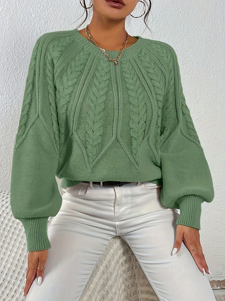 Elegante maglia da donna a trecce con maniche a palloncino. Perfetta per la moda invernale.
