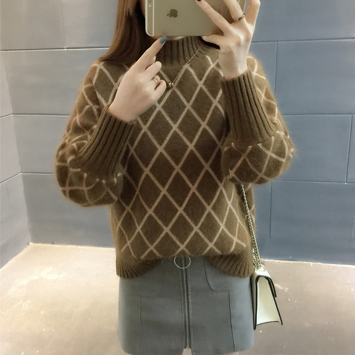 Maglione pullover da donna a rombi con scollo rotondo, ideale per un look casual o elegante autunno/inverno.