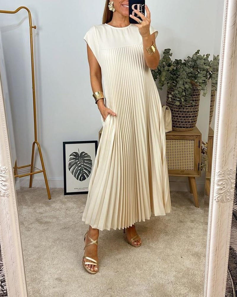 Abito maxi plissettato elegante da donna, fluido e raffinato per cerimonia estiva.