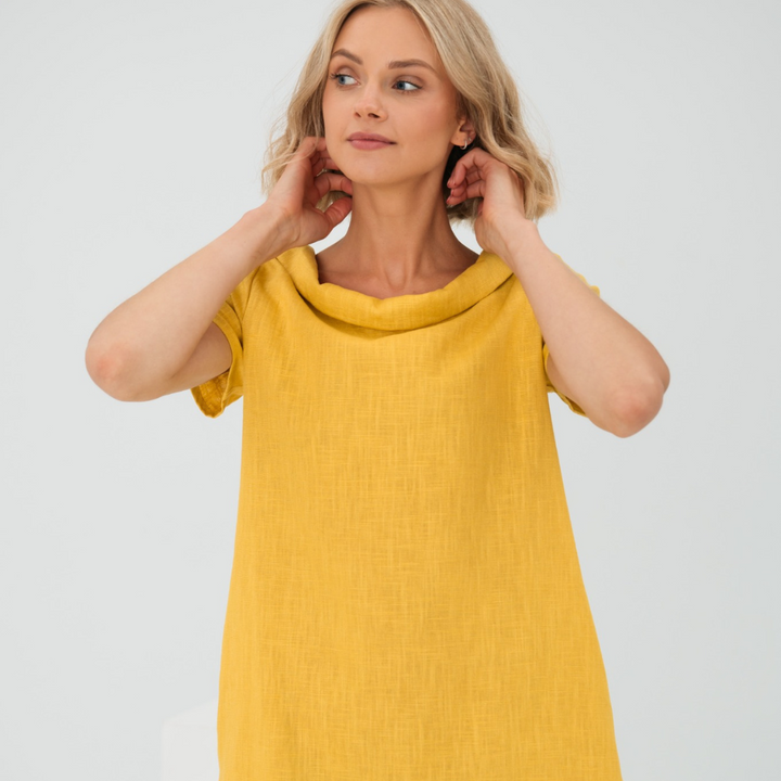 Abito donna in lino morbido per vacanze o casual, con tasche pratiche e stile fluido.