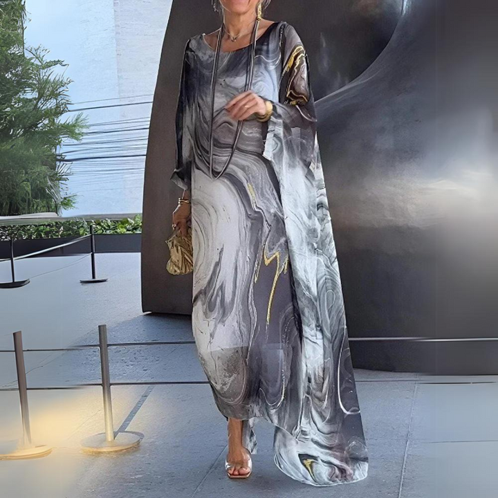 Abito lungo donna con caduta fluida, ideale per un outfit elegante e raffinato.