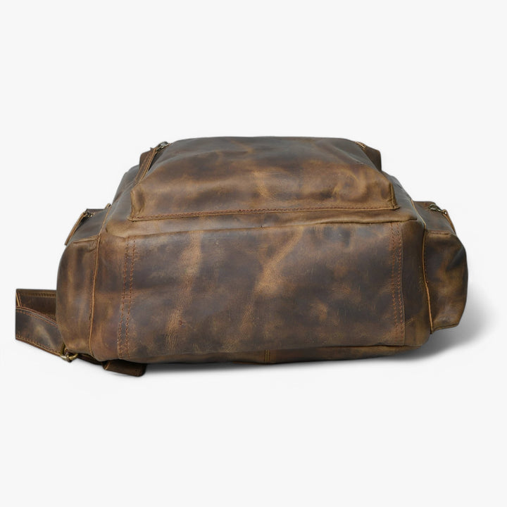 Zaino marrone dal design moderno, spazioso e funzionale, perfetto per viaggi e uso giornaliero unisex.