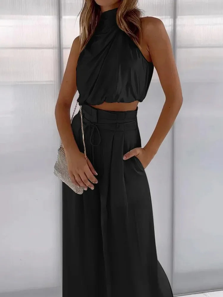 Abbigliamento donna estivo: coordinato versatile crop top e pantaloni palazzo, comodo per viaggi o tempo libero.