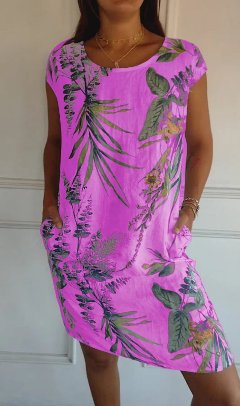 Abito donna elegante ma casual, senza maniche, con motivo botanico e tasche nascoste.