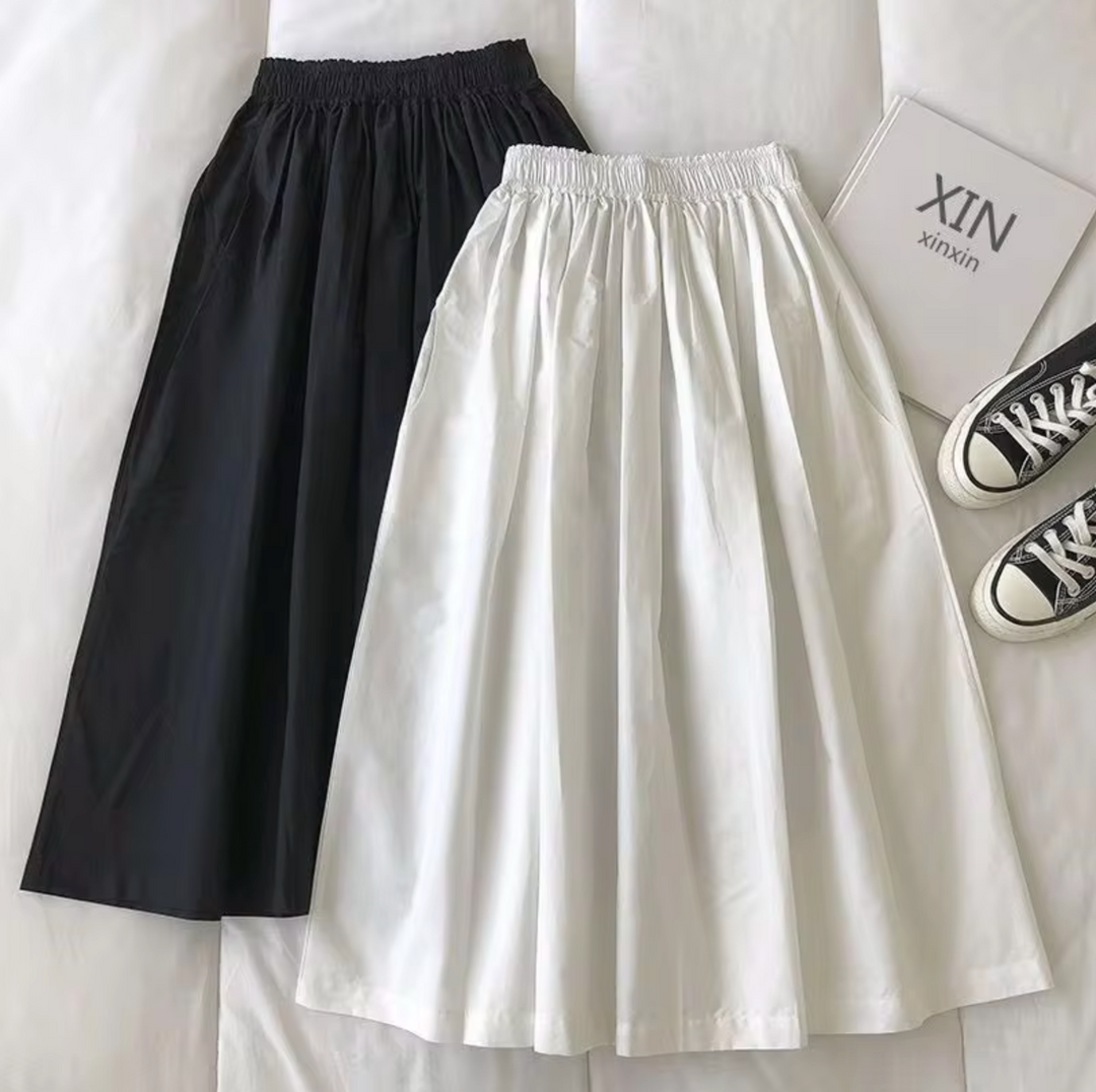 Gonna lunga a vita alta per donna, comoda e di tendenza, con taglio ampio per un outfit estivo chic.