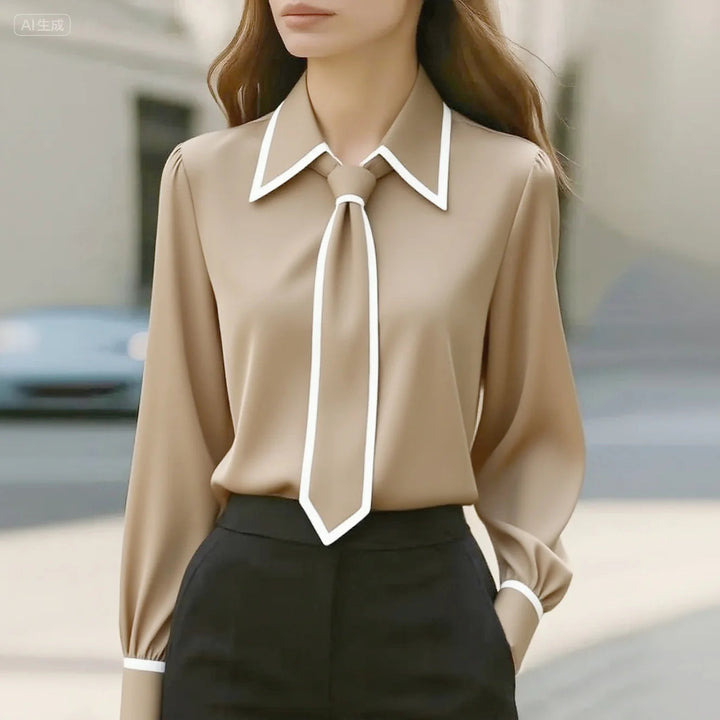 Blusa donna elegante versatile con colletto a contrasto, maniche lunghe. Ideale per look da ufficio o casual chic.
