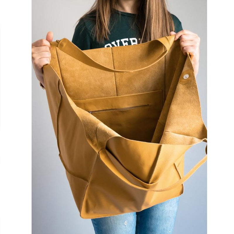 Borsa donna stile vintage con tracolla, accessorio moda essenziale per l'eleganza.