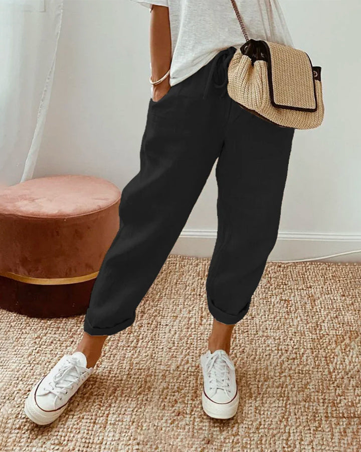 Pantaloni casual lunghi da donna a vita media, versatili per tutte le stagioni. Comodi e alla moda.