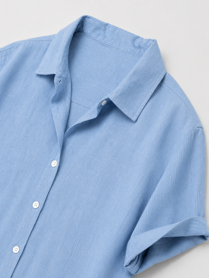 Camicia uomo casual estiva azzurro, maniche corte, ideale per spiaggia, vacanze e tempo libero.