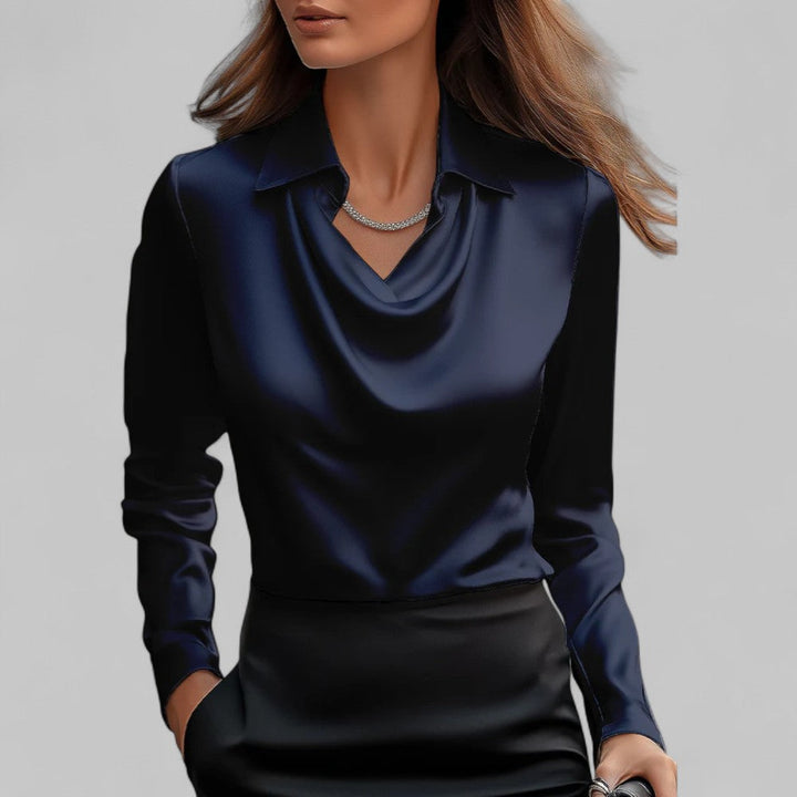 Stilosa blusa in satin per donna, con dettagli di collo drappeggiato e maniche lunghe. Moda primaverile.
