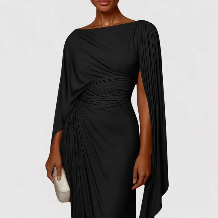 Vestito lungo plissettato fluido, ideale per eventi eleganti e cerimonie. Abito da donna chic e confortevole.