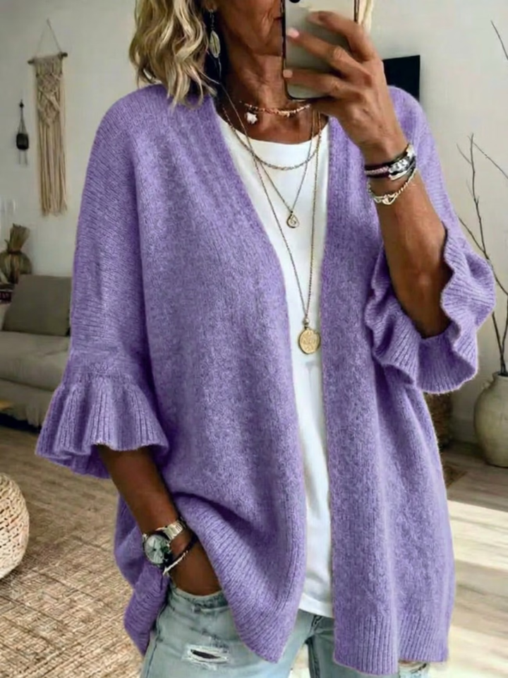 Cardigan donna aperto per primavera/autunno, elegante con maniche a volant. Offre comfort e stile versatile.