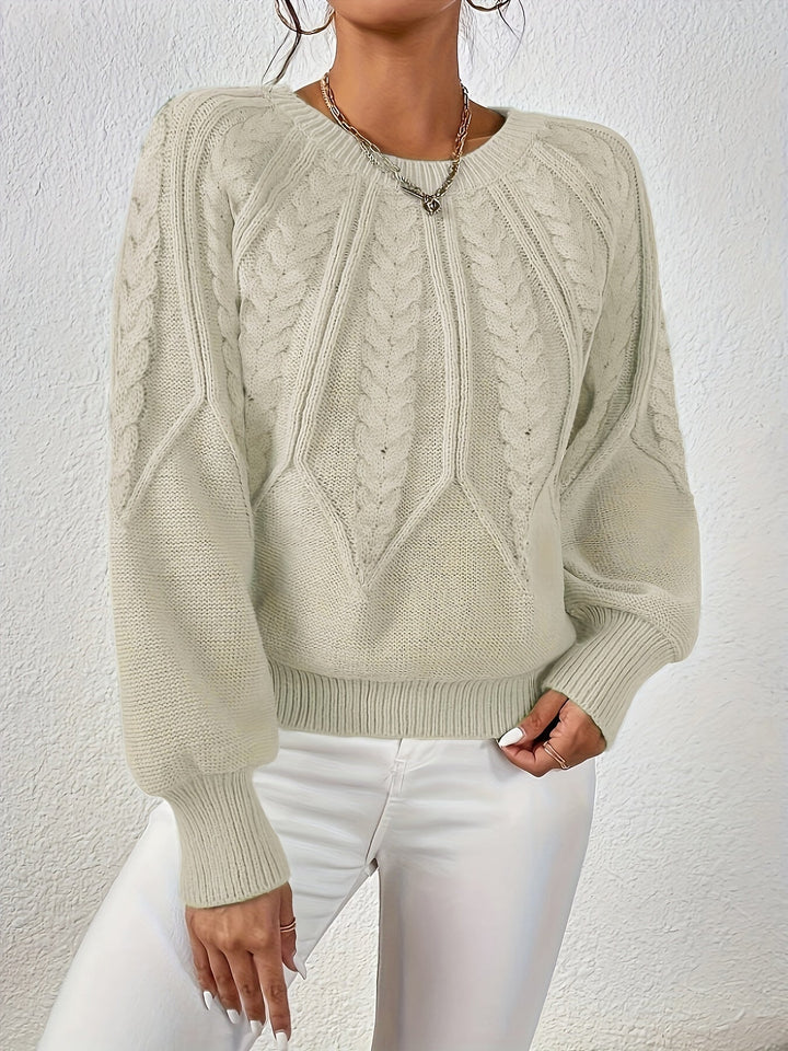 Maglione da donna a trecce, maniche a palloncino. Un tocco di eleganza casual.