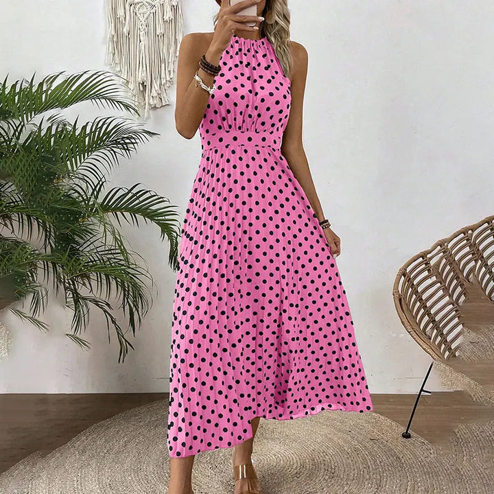 Abito femminile a pois, modello maxi, con collo halter per un look elegante o casual estivo.