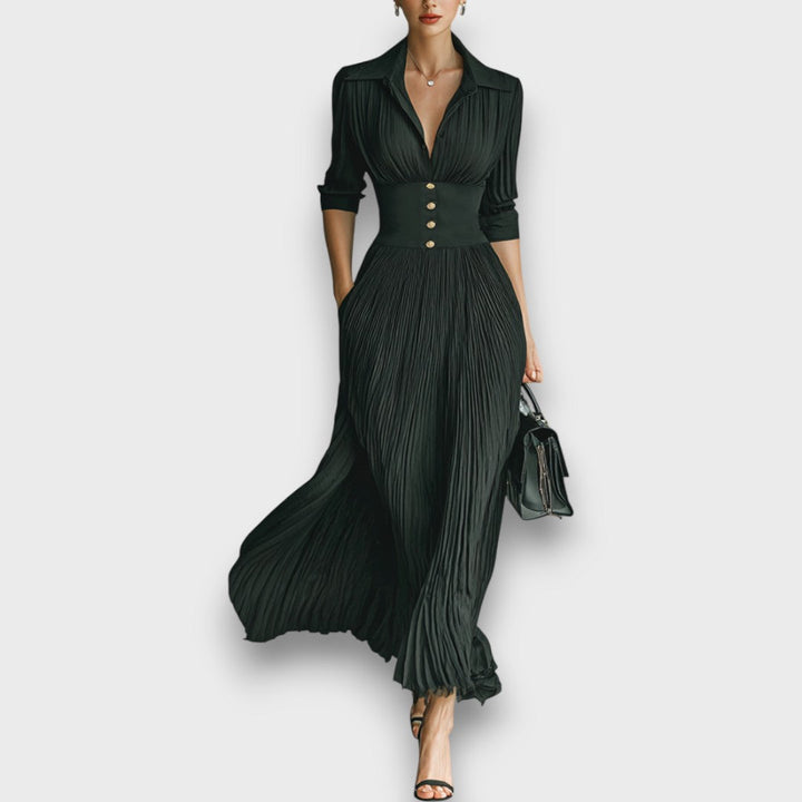 Abito maxi donna elegante nero con colletto revers e gonna plissettata, perfetto per serate formali e moda.