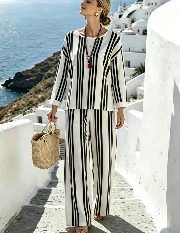 Set donna casual estivo, con top asimmetrico ampio e shorts comodi, ideale per la moda mare e vacanze.