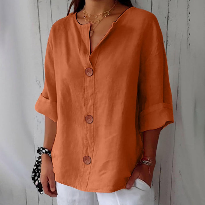 Blusa donna in lino, collo alla coreana, bottoni frontali, perfetta per le calde giornate estive.