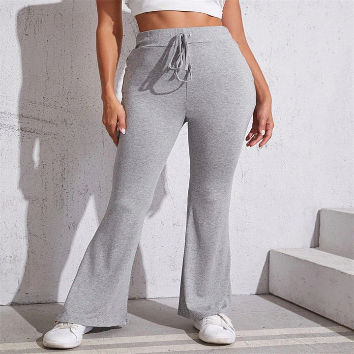 Pantaloni donna grigi larghi, vita alta, perfetti per comfort e stile chic. Ideali casual o ufficio.