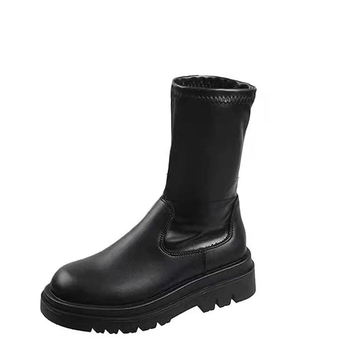 Stivali alti donna elasticizzati neri sopra il ginocchio con tacco medio. Calzature versatili per outfit autunnali fashion.