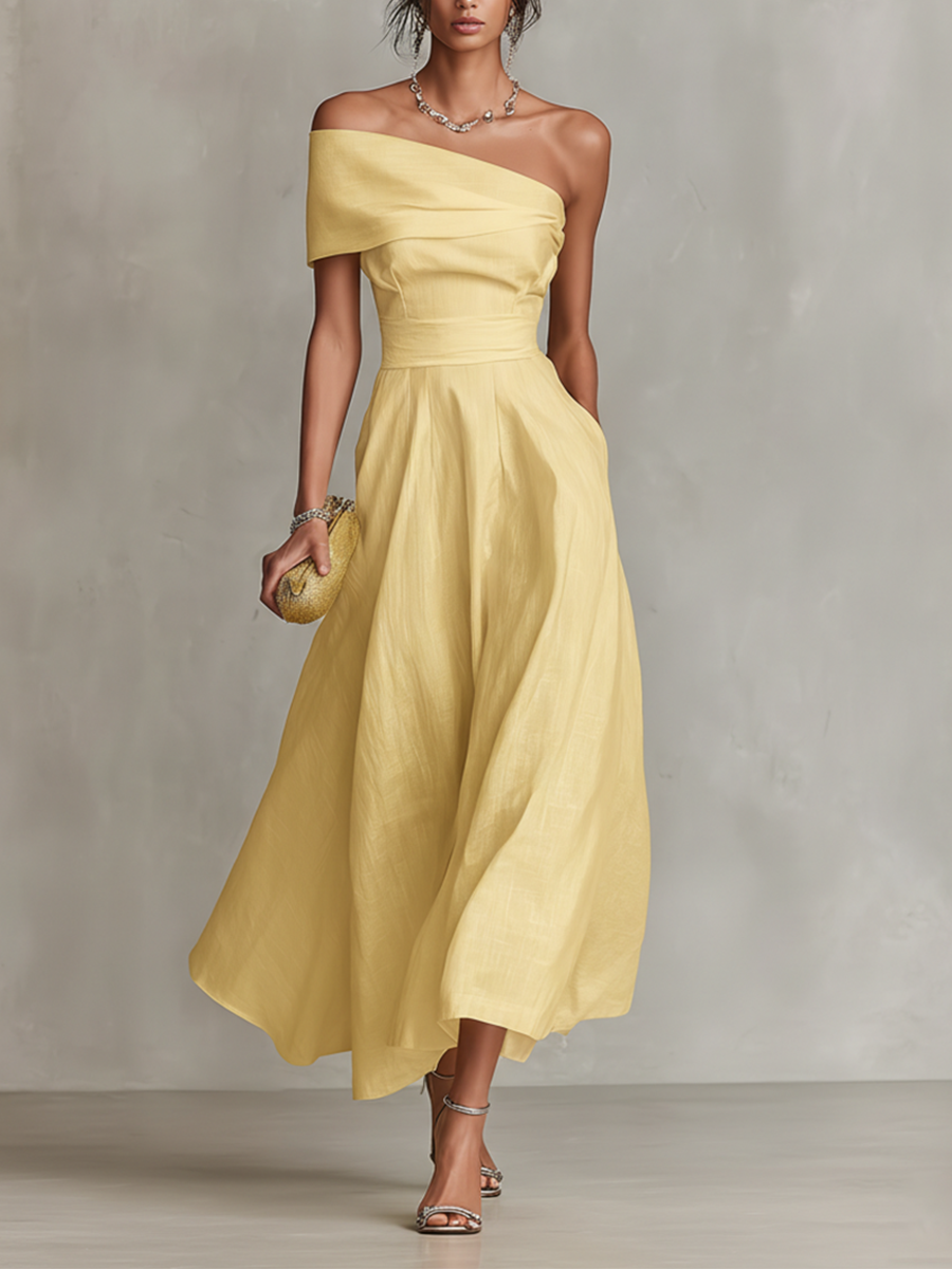 Abito da donna in lino giallo monospalla, elegante e fresco, ideale per la moda estiva e le vacanze chic.