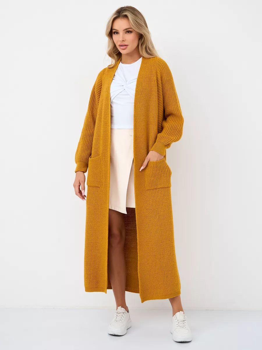 Cardigan donna lungo con tasche ampie e apertura frontale, un capo chic per l'inverno.