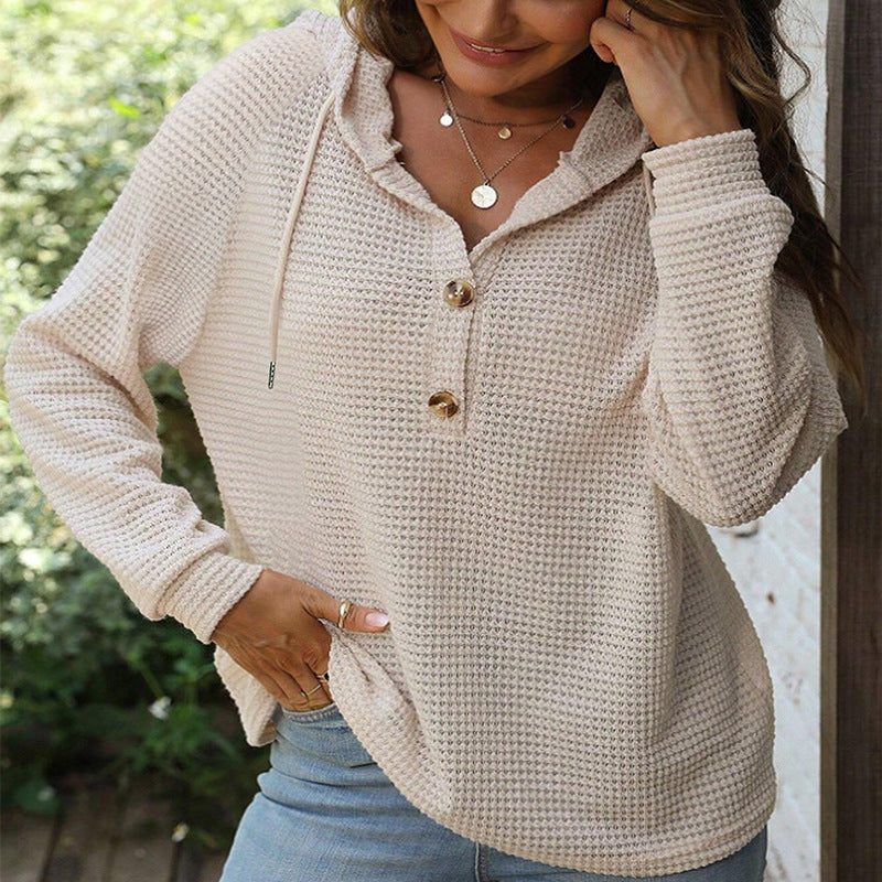 Felpa donna con cappuccio e bottoni, vestibilità ampia per comfort casual quotidiano.