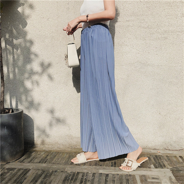 Pantaloni donna eleganti, pieghettati con taglio cropped e gamba larga, ideali per l'ufficio o il tempo libero.