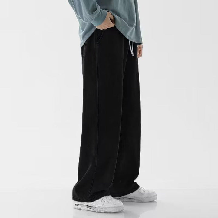 Pantaloni casual uomo, vestibilità comoda a gamba larga e vita media. Perfetti per l'abbigliamento streetwear.