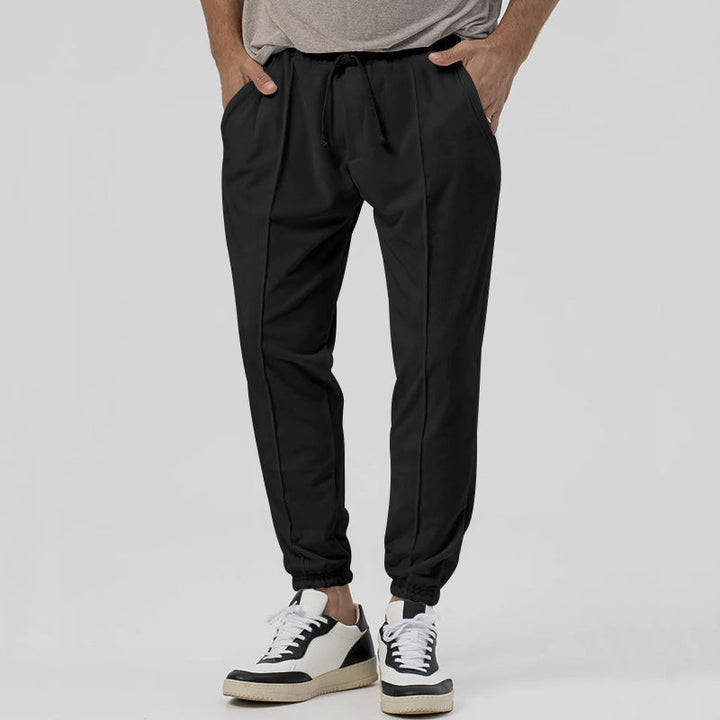 Pantaloni tuta uomo tapered, vita media, gamba affusolata, comfort streetwear per il tuo stile.
