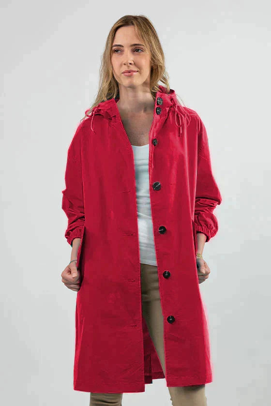 Giacca antipioggia donna rosa pastello, oversize, con cappuccio, ideale per un tocco elegante.