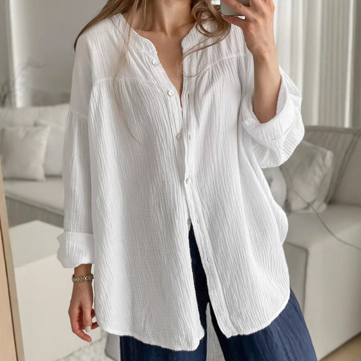 Camicia bianca donna manica lunga, stile casual chic o ufficio. Colletto coreana e cintura per un tocco moderno.