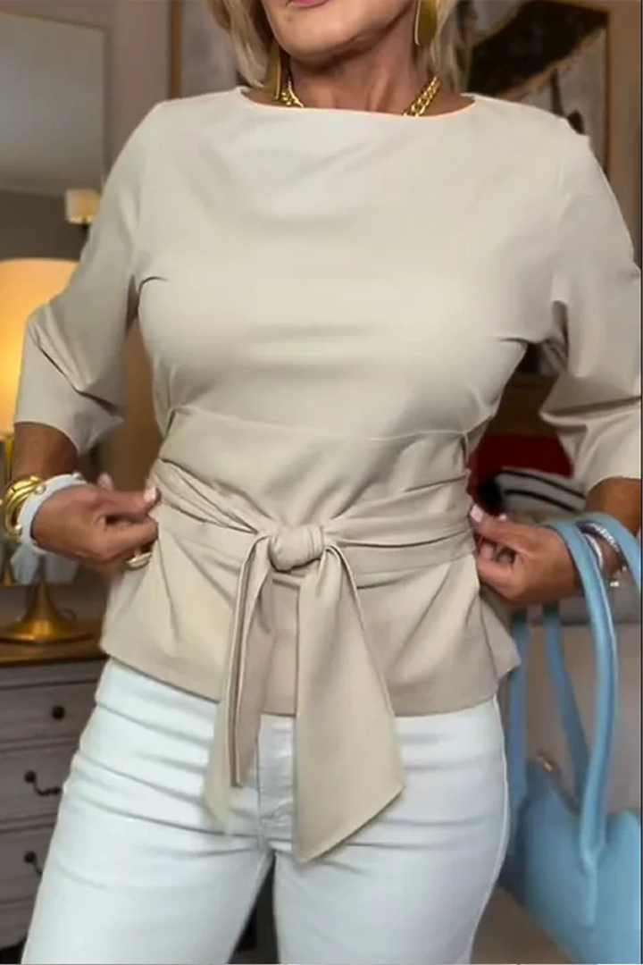 Top donna versatile con fiocco regolabile in vita, perfetto per un abbigliamento quotidiano o un tocco chic serale.