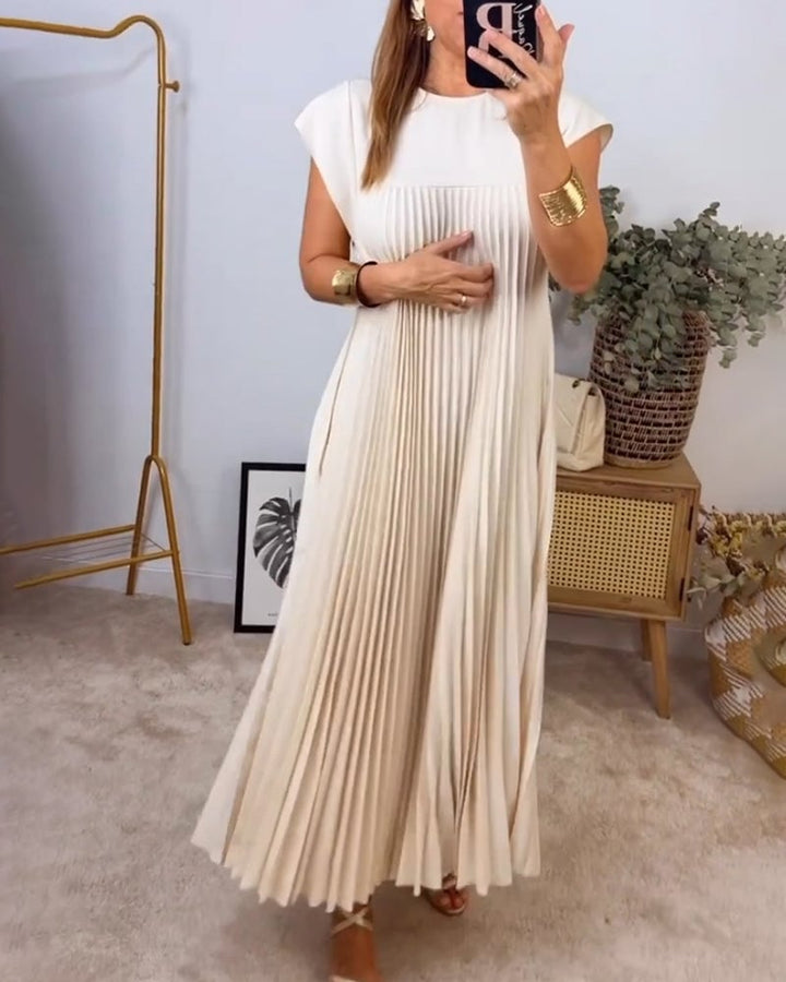 Abito plissettato maxi da donna, tessuto fluido e raffinato, perfetto per un look estivo elegante.